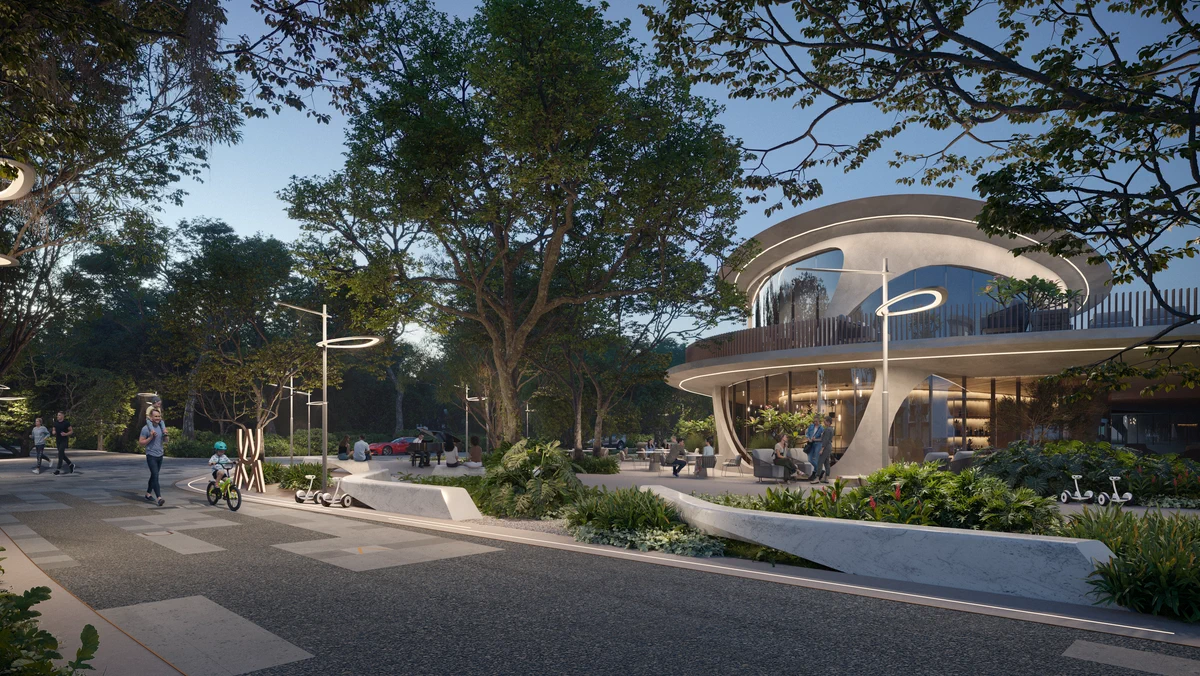Pedestrian boulevard beside an organic community building at Aldea Uh May